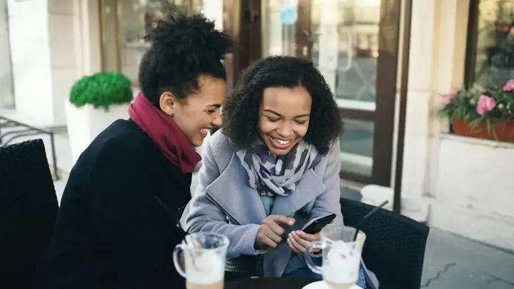Local people talking together over coffee